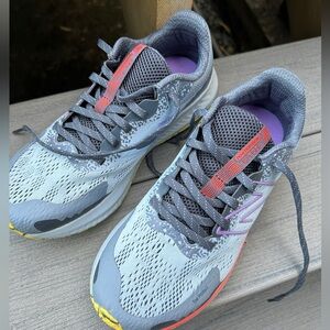 Size 8.5 New Balance runner. Worn a few times around the house